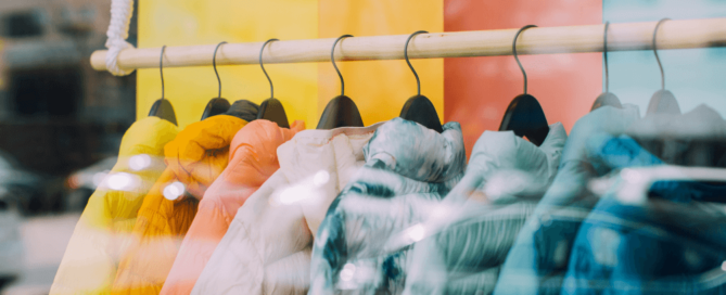 What Digital Transformation Really Means for Fashion Retailers - Q&A Blog Post - Women with shopping bags on phone